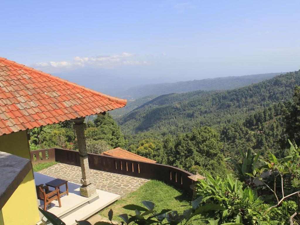 a house with a view of the mountains at Aryautama Garden Villa in Munduk