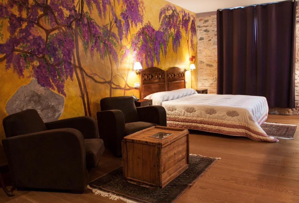 Postel nebo postele na pokoji v ubytování Hotel Moli De La Torre
