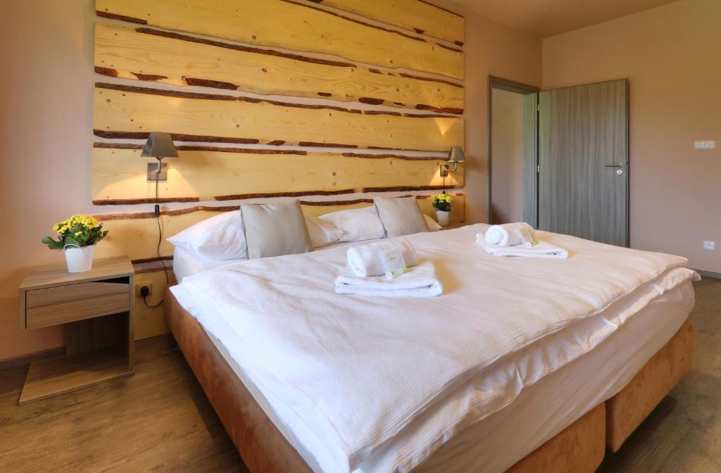 Una cama o camas en una habitación de Hotel Obzor