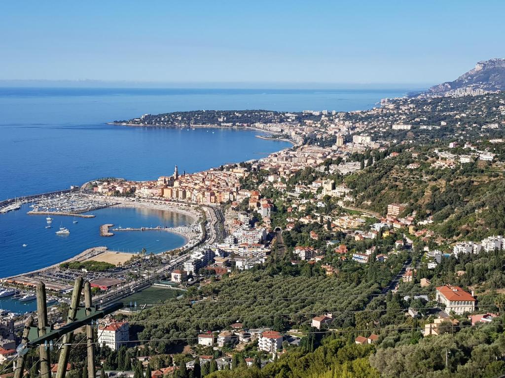 an aerial view of a city and the ocean at Olguita in Menton