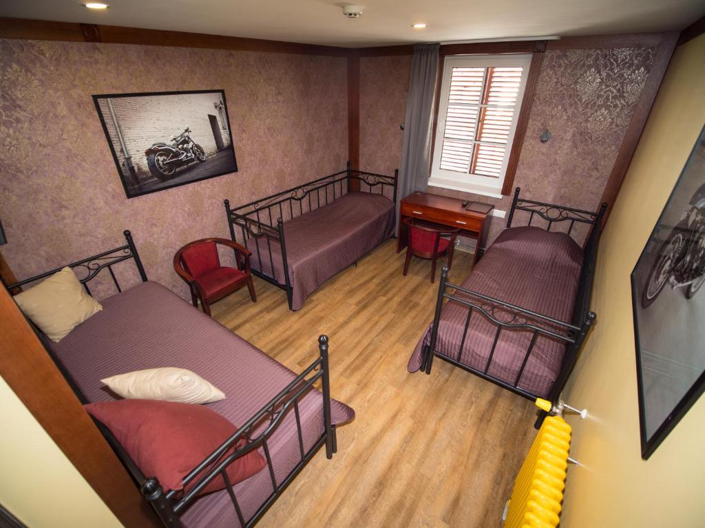Voodi või voodid majutusasutuse Aleksandri Guesthouse toas