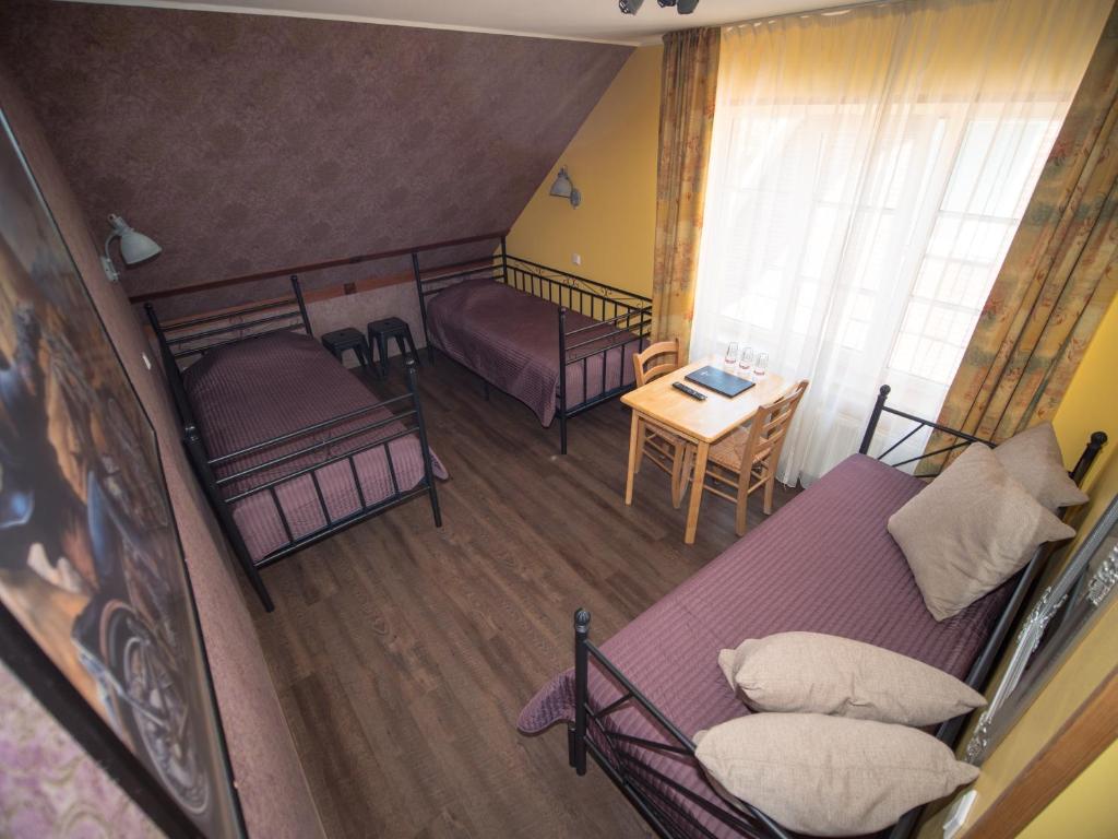 Voodi või voodid majutusasutuse Aleksandri Guesthouse toas