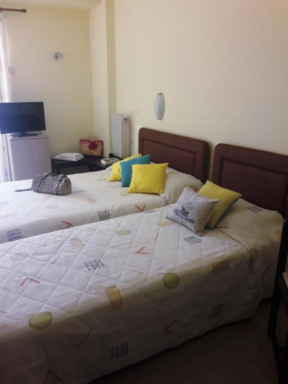 Postel nebo postele na pokoji v ubytování Hotel Florakis
