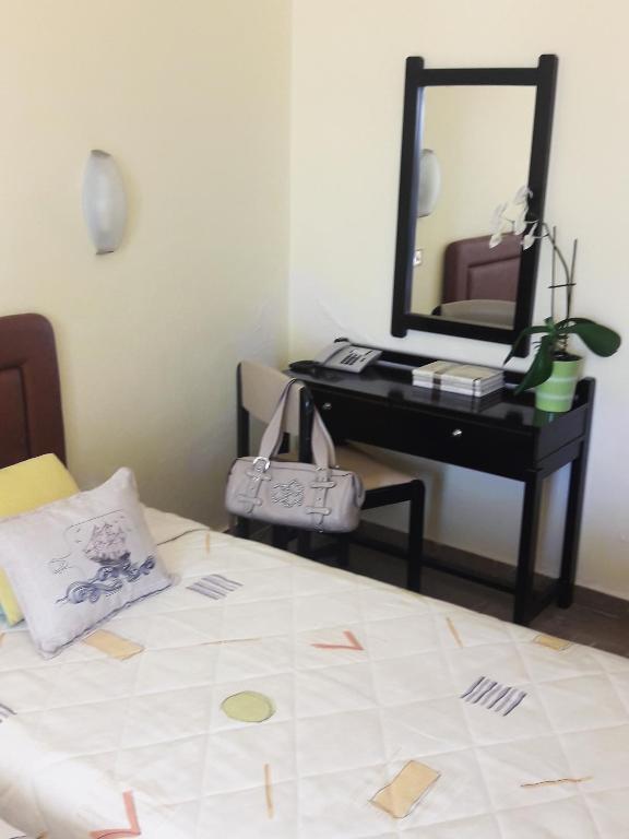 Postel nebo postele na pokoji v ubytování Hotel Florakis
