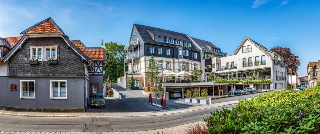 a group of buildings on a city street at AKZENT Hotel Villa Saxer in Goslar