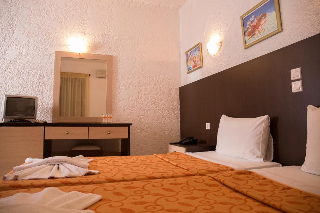 Postel nebo postele na pokoji v ubytování Hotel Elena Syvota