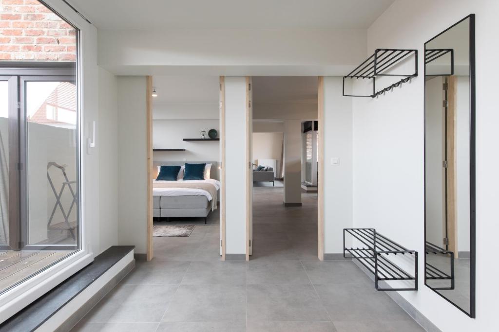 Postel nebo postele na pokoji v ubytování Raveel Lofts