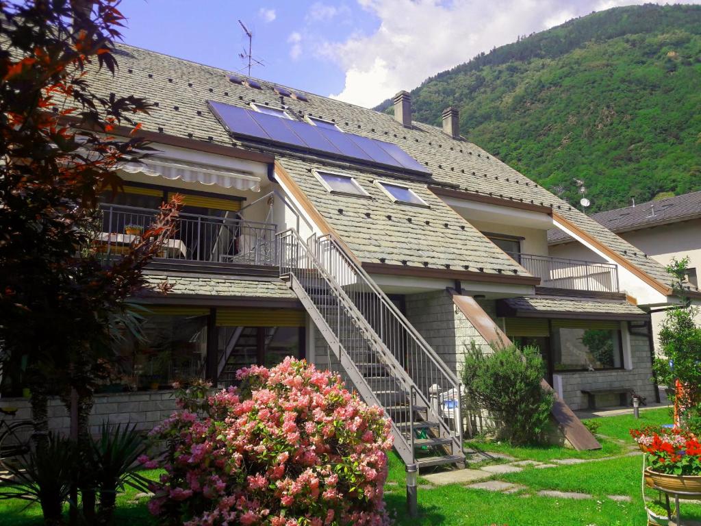 a house with a solar panel on the roof at Casa Vacanze Santa Perpetua in Tirano