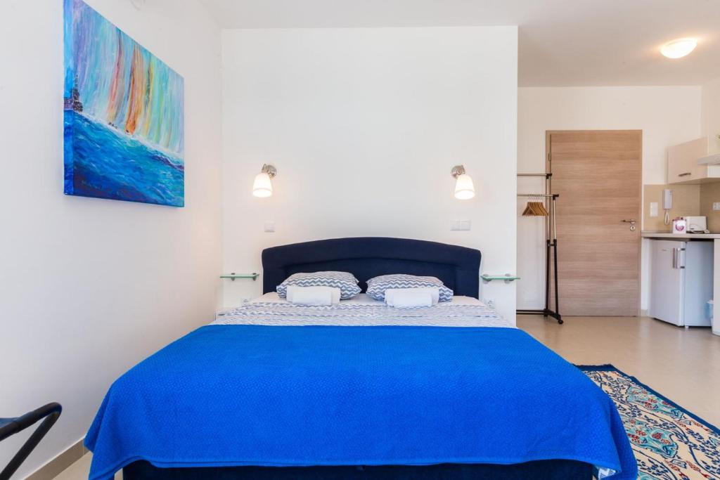 Postel nebo postele na pokoji v ubytování Villa Ria