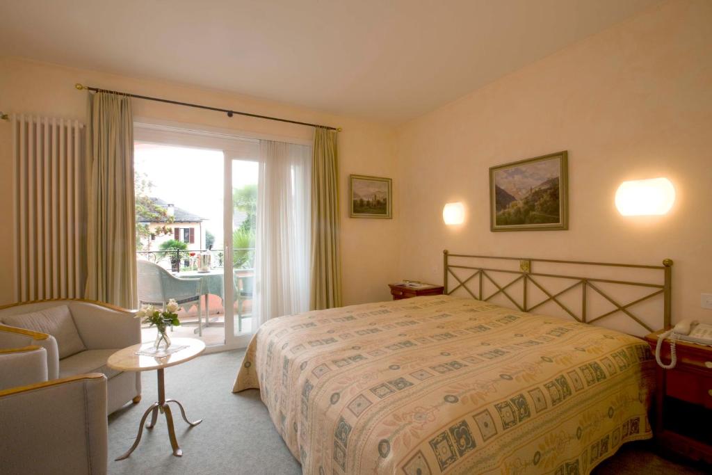 Postel nebo postele na pokoji v ubytování Romantik Hotel Castello Seeschloss