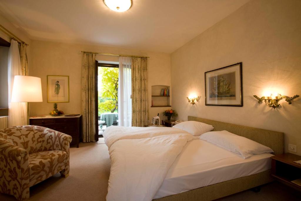 Postel nebo postele na pokoji v ubytování Romantik Hotel Castello Seeschloss
