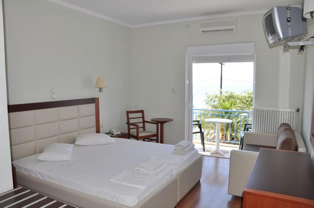 Postel nebo postele na pokoji v ubytování Elena Hotel