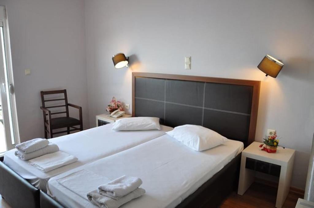 Postel nebo postele na pokoji v ubytování Elena Hotel