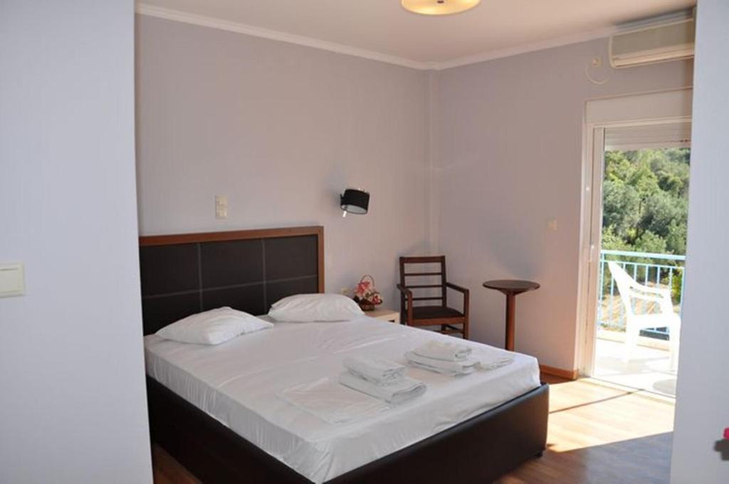Postel nebo postele na pokoji v ubytování Elena Hotel