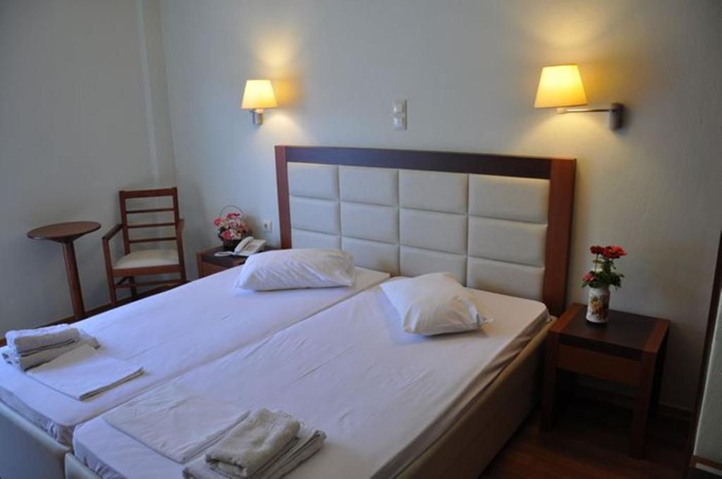 Postel nebo postele na pokoji v ubytování Elena Hotel