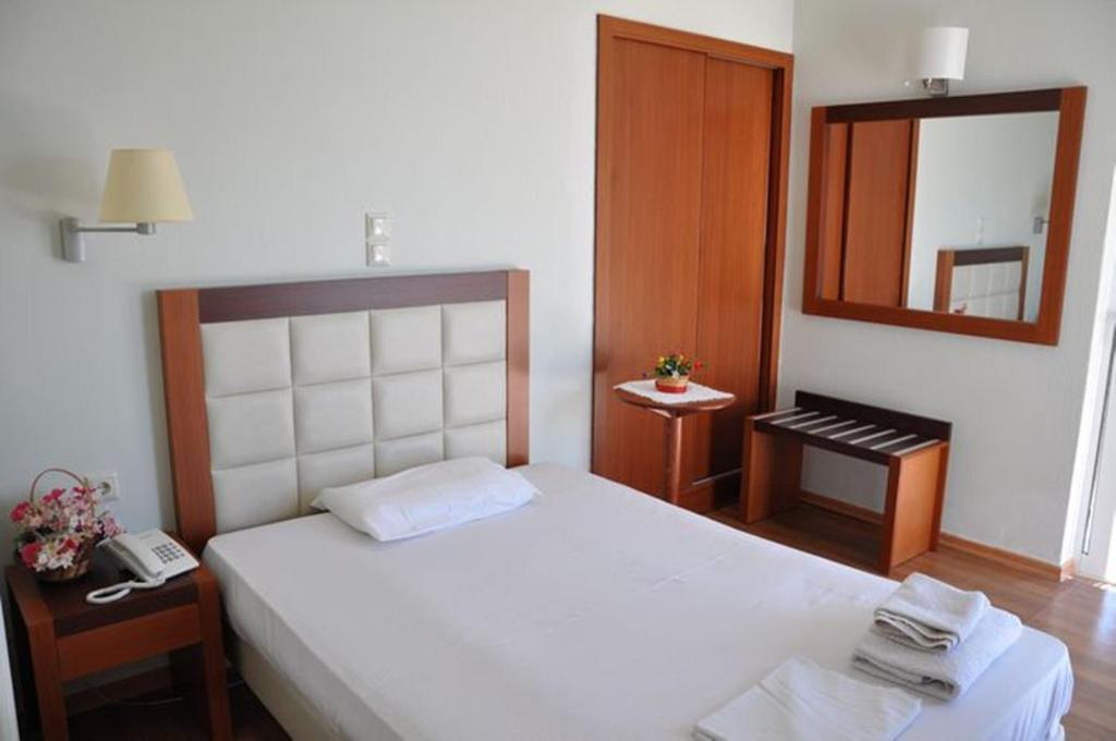 Postel nebo postele na pokoji v ubytování Elena Hotel