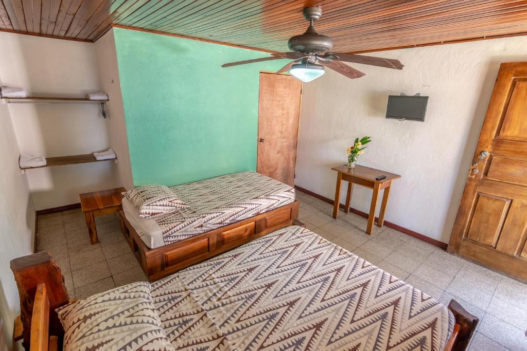 Postel nebo postele na pokoji v ubytování Cabinas Arrecife