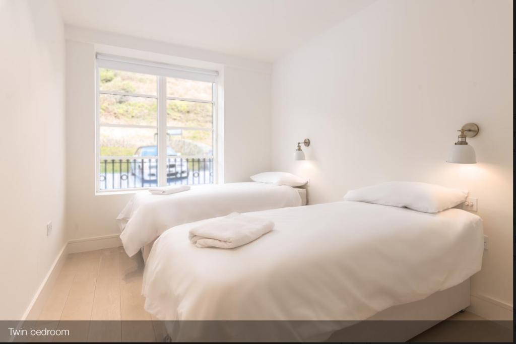 Кровать или кровати в номере Chalet Saunton