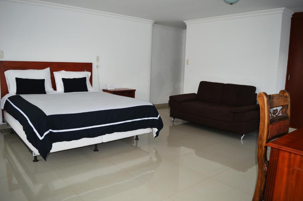 Postel nebo postele na pokoji v ubytování COLOMBIA-Hotel Hontibon