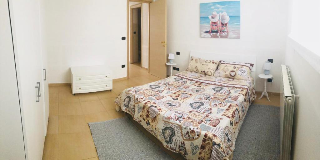 A bed or beds in a room at Appartamento sul mare