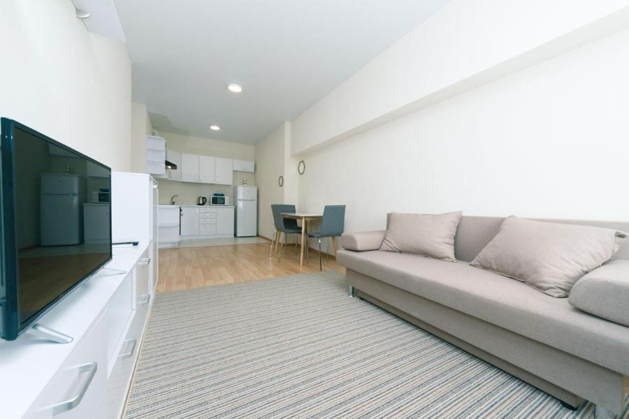 TV a/nebo společenská místnost v ubytování FlatRent SmartHouse