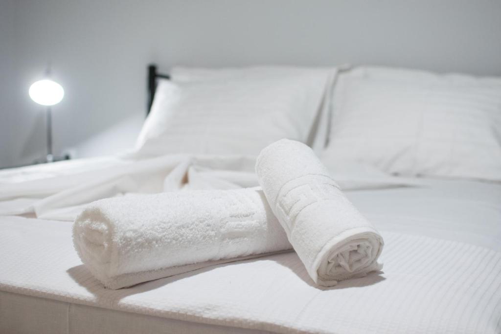 A bed or beds in a room at FINIKAS House