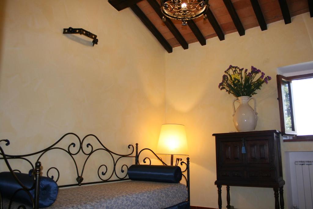 Łóżko lub łóżka w pokoju w obiekcie Agriturismo Borgo Il Bonagino