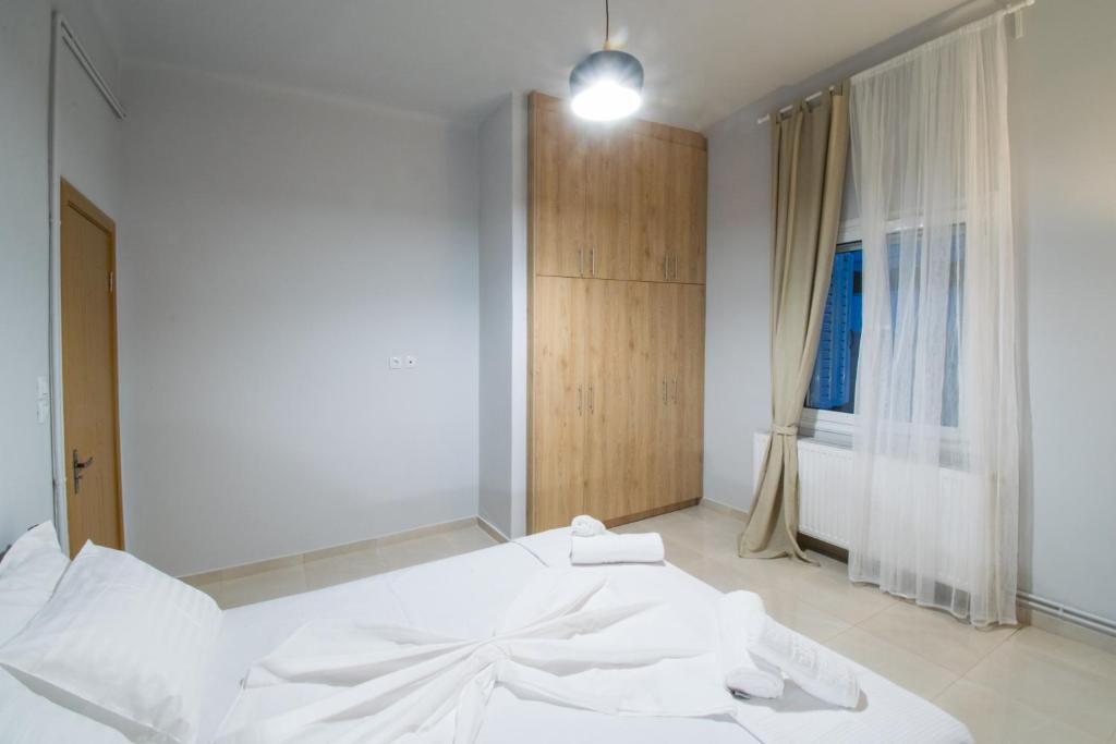 A bed or beds in a room at FINIKAS House