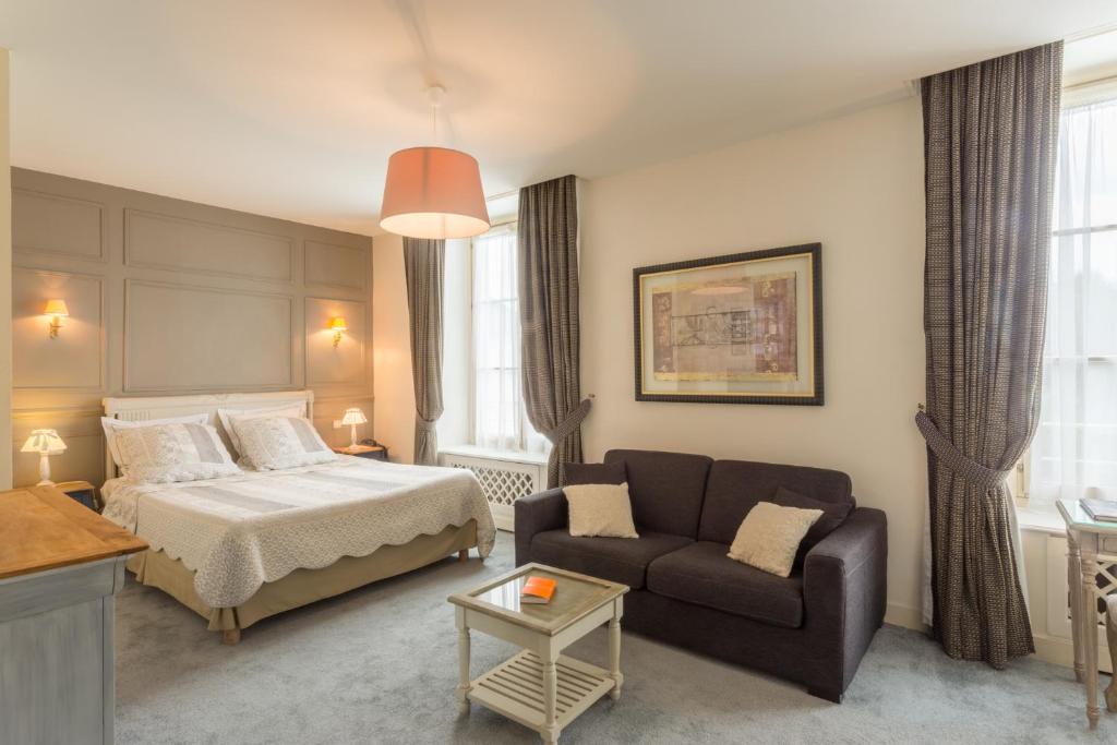 Postelja oz. postelje v sobi nastanitve Hôtel-Restaurant Ricordeau