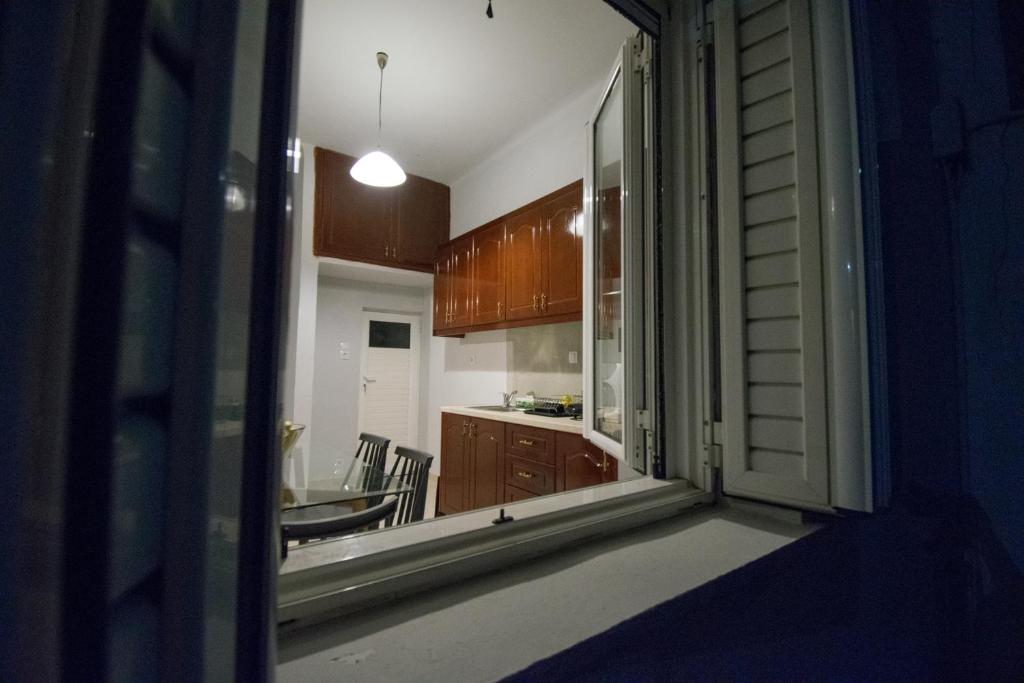 A kitchen or kitchenette at FINIKAS House