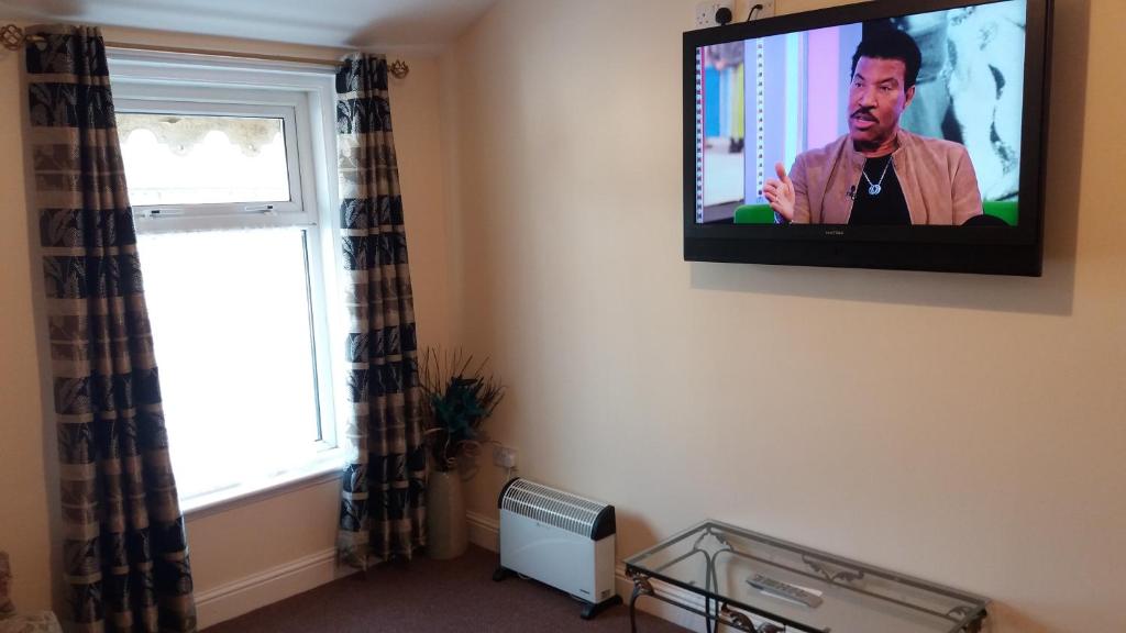 TV a/nebo společenská místnost v ubytování delamere holiday apartments