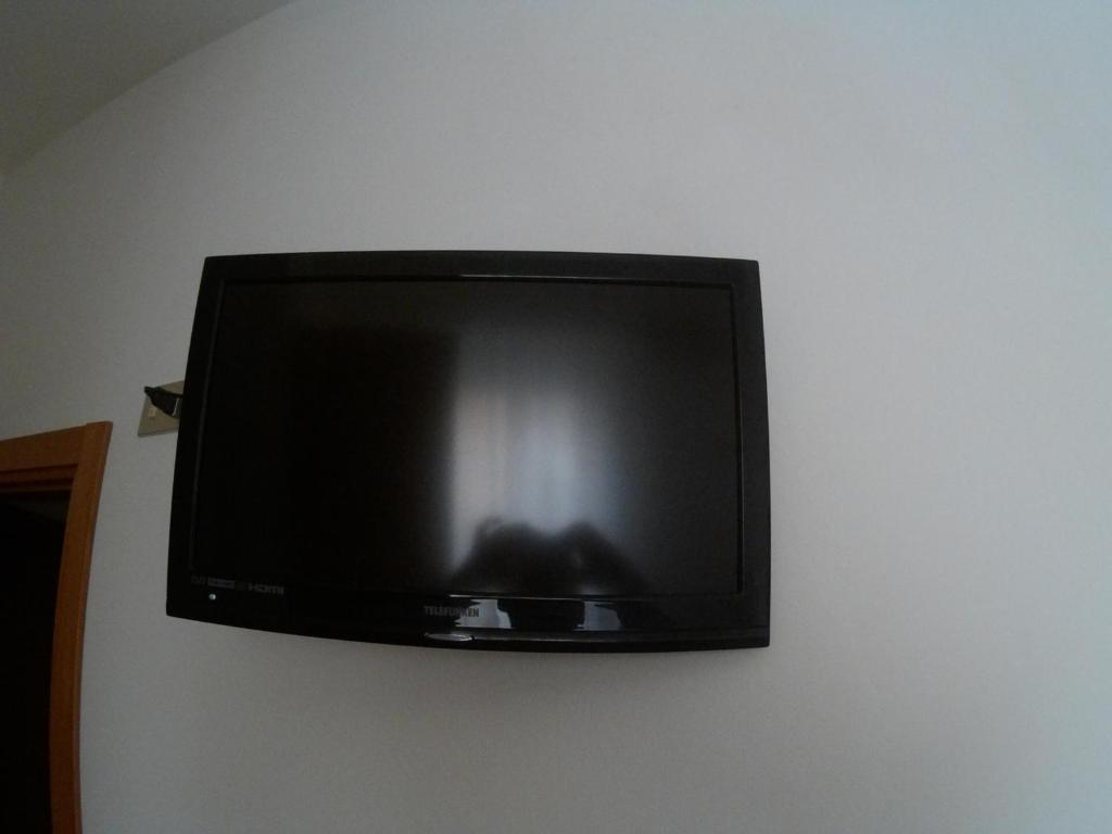 TV a/nebo společenská místnost v ubytování Hotel Azzurro