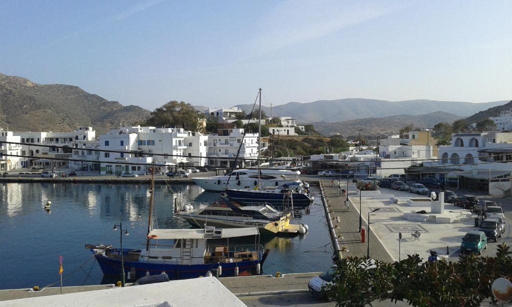a group of boats are docked in a harbor at Yacht Front Studio - No 5 in Ios Chora