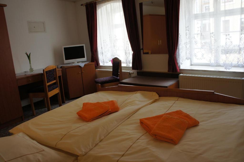 Postel nebo postele na pokoji v ubytování Goldener Engel /Pension