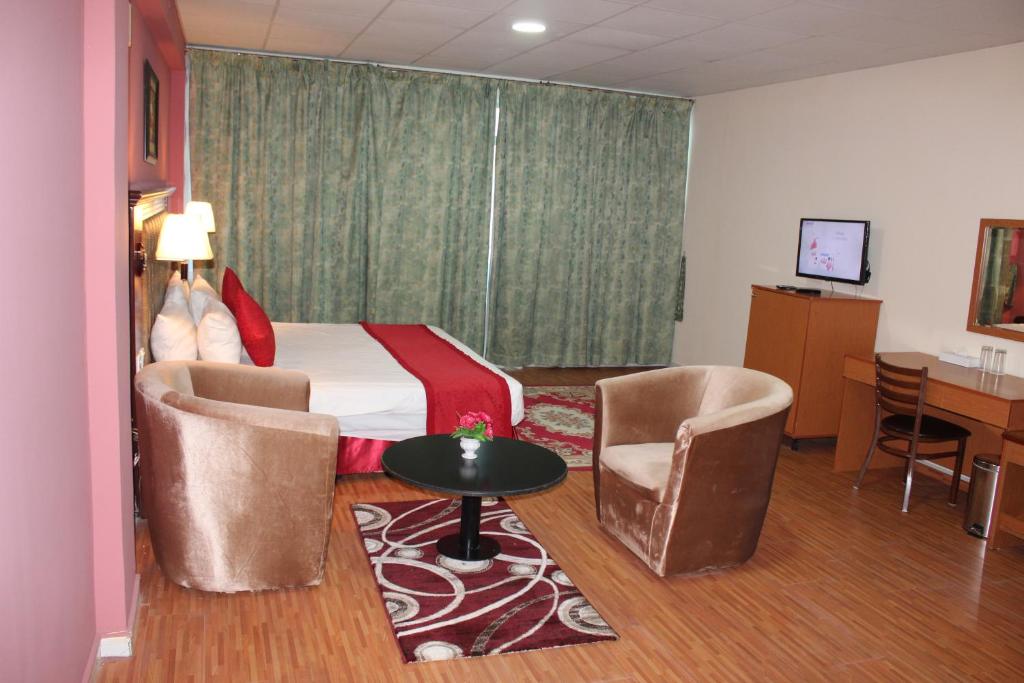 TV a/nebo společenská místnost v ubytování Grand Nova Hotel