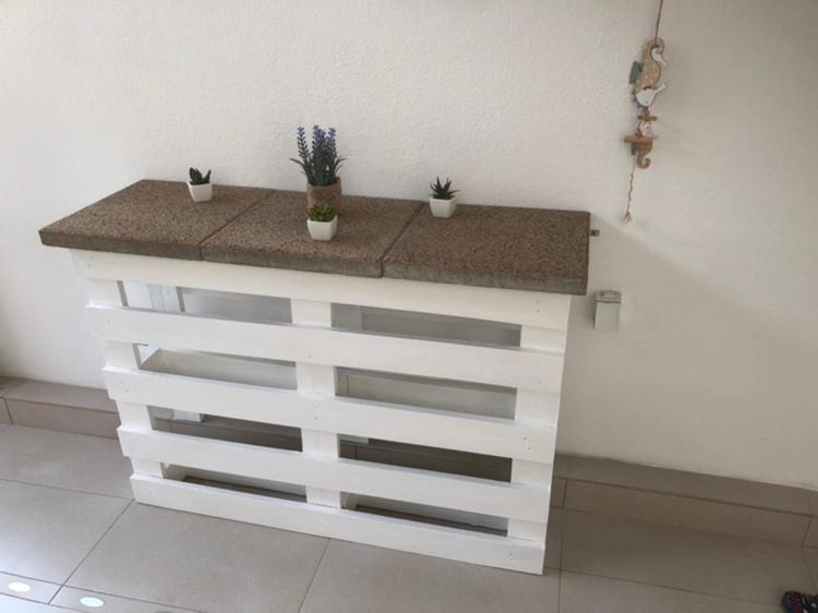 a white counter with potted plants on top of it at Apartman Mara in Hvar