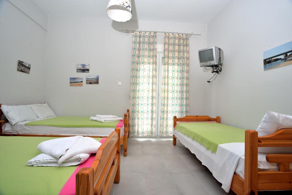 A bed or beds in a room at Apartments Konstantinidis