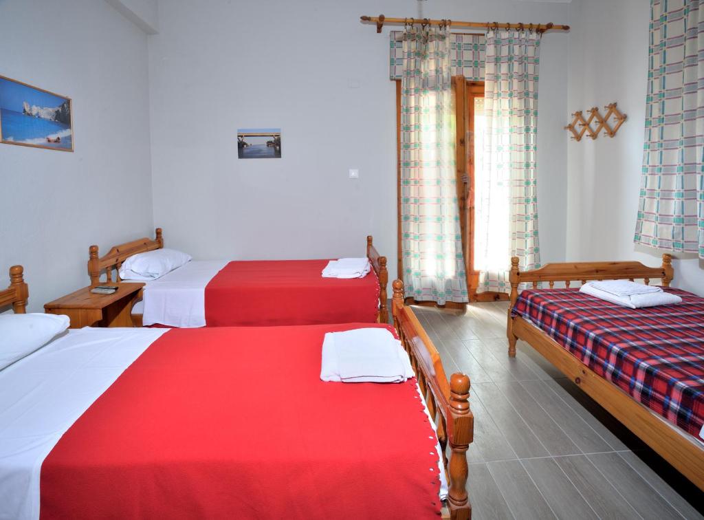 A bed or beds in a room at Apartments Konstantinidis