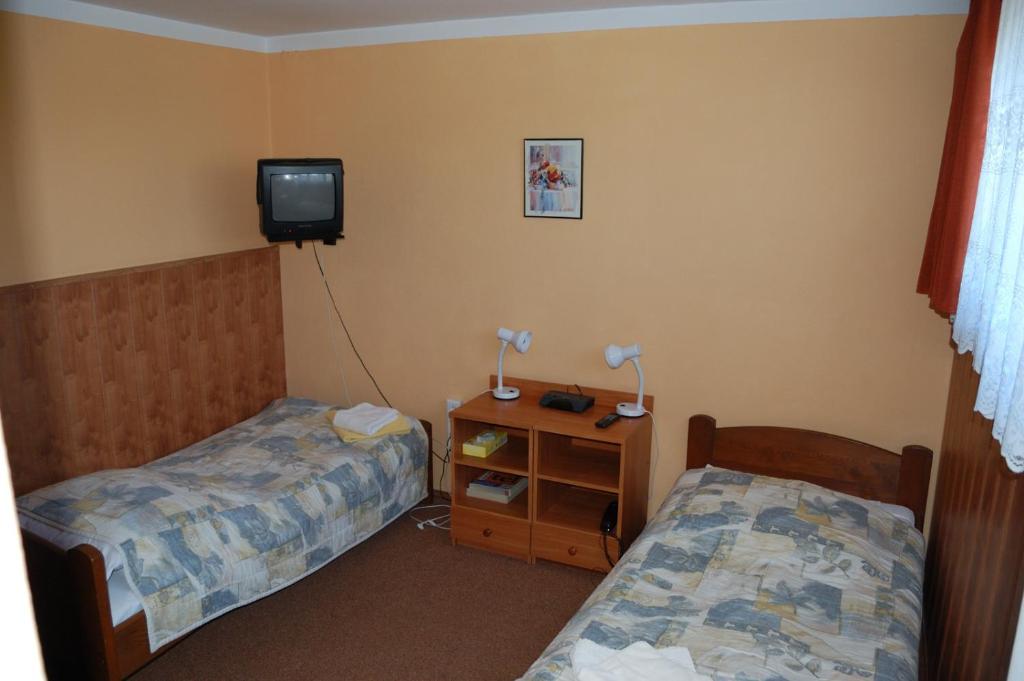 Posteľ alebo postele v izbe v ubytovaní Hotel Bona