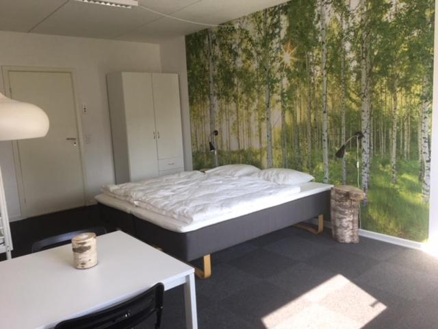 Uma cama ou camas num quarto em Thommysminde