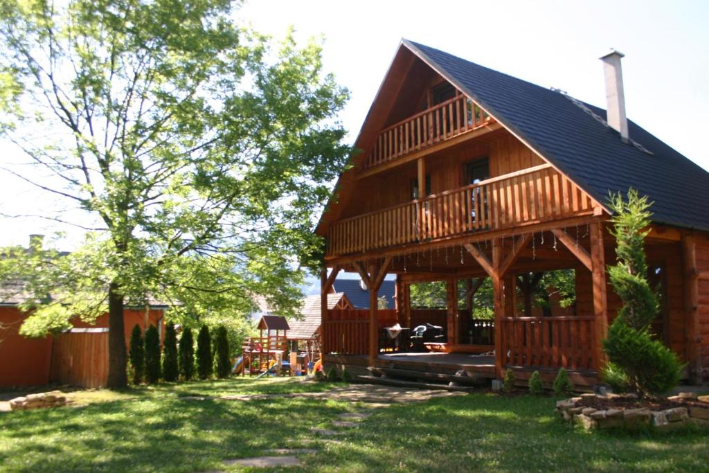 a log cabin with a gambrel roof at Zbojnícka drevenica 3 in Liptovský Mikuláš