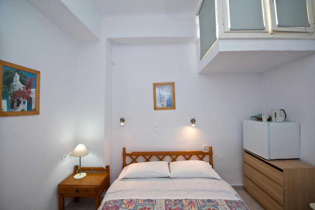 Postel nebo postele na pokoji v ubytování Karboni Hotel