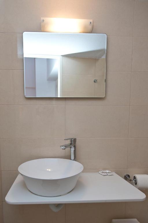 Koupelna v ubytování Karboni Hotel
