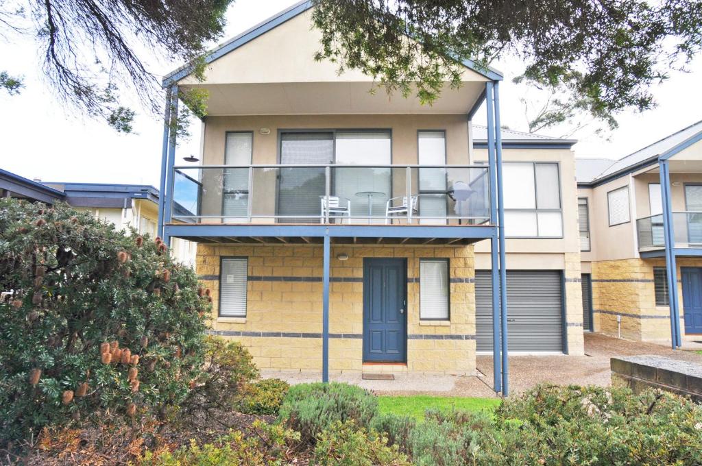 a house with a balcony in front of it at BLISS - CLOSE TO TOWN in Inverloch