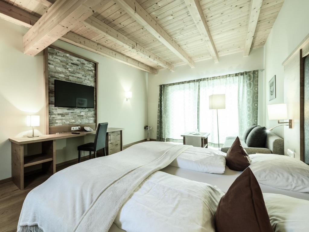 Postel nebo postele na pokoji v ubytování Hotel Victoria