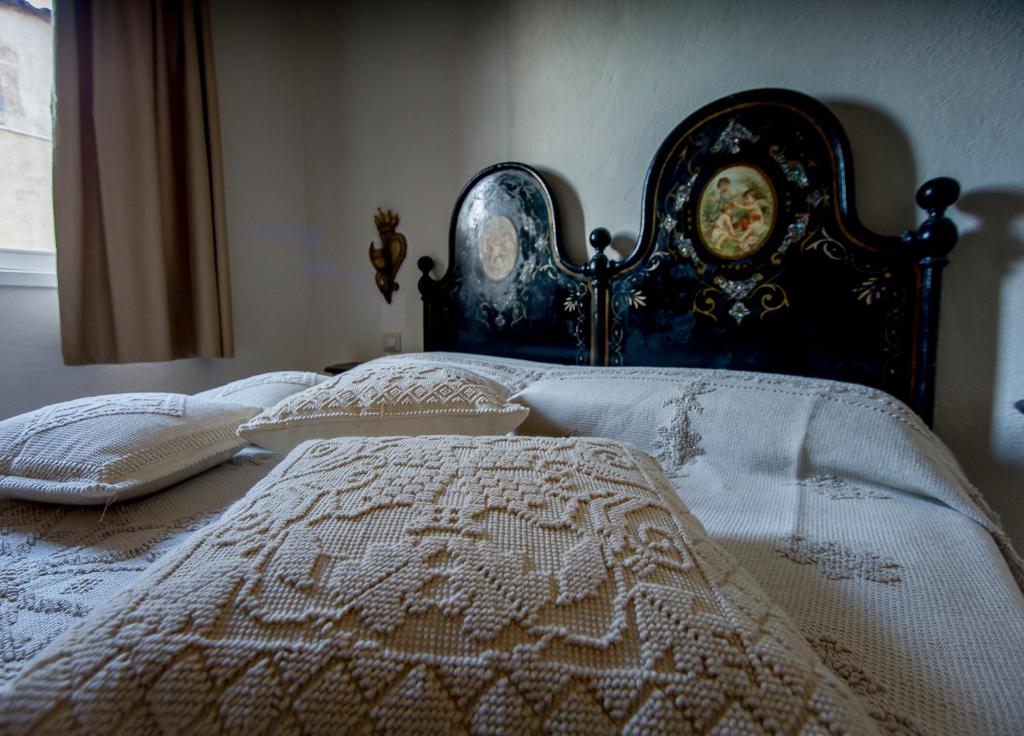Postel nebo postele na pokoji v ubytování Antica Dimora La Corona