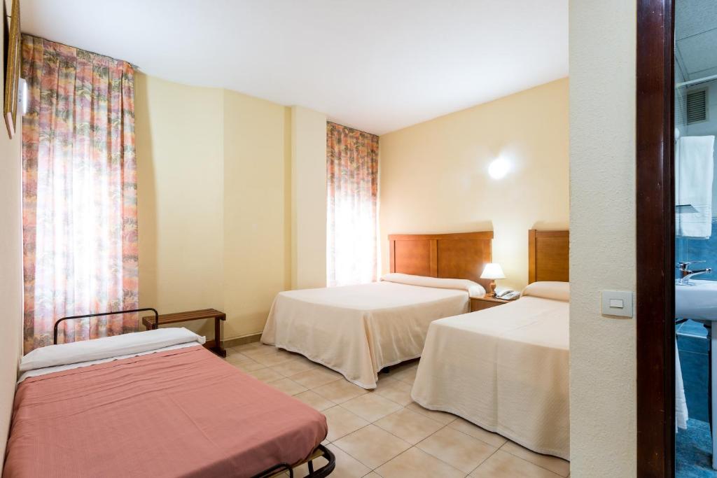 Postel nebo postele na pokoji v ubytování Apartamentos Resitur