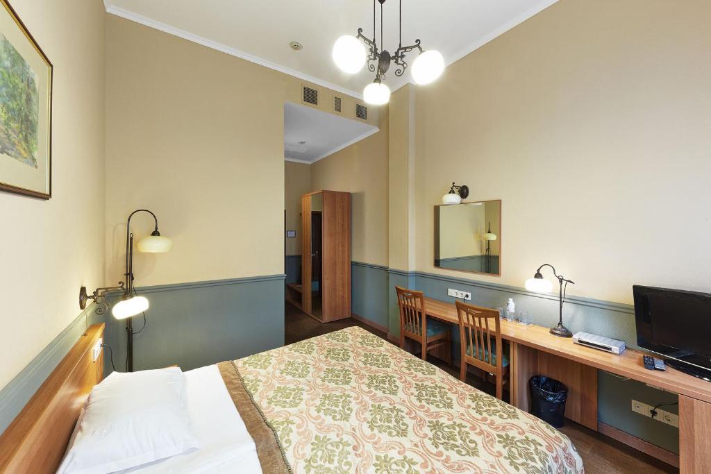 Postel nebo postele na pokoji v ubytování Frapolli Hotel on Deribasivska street