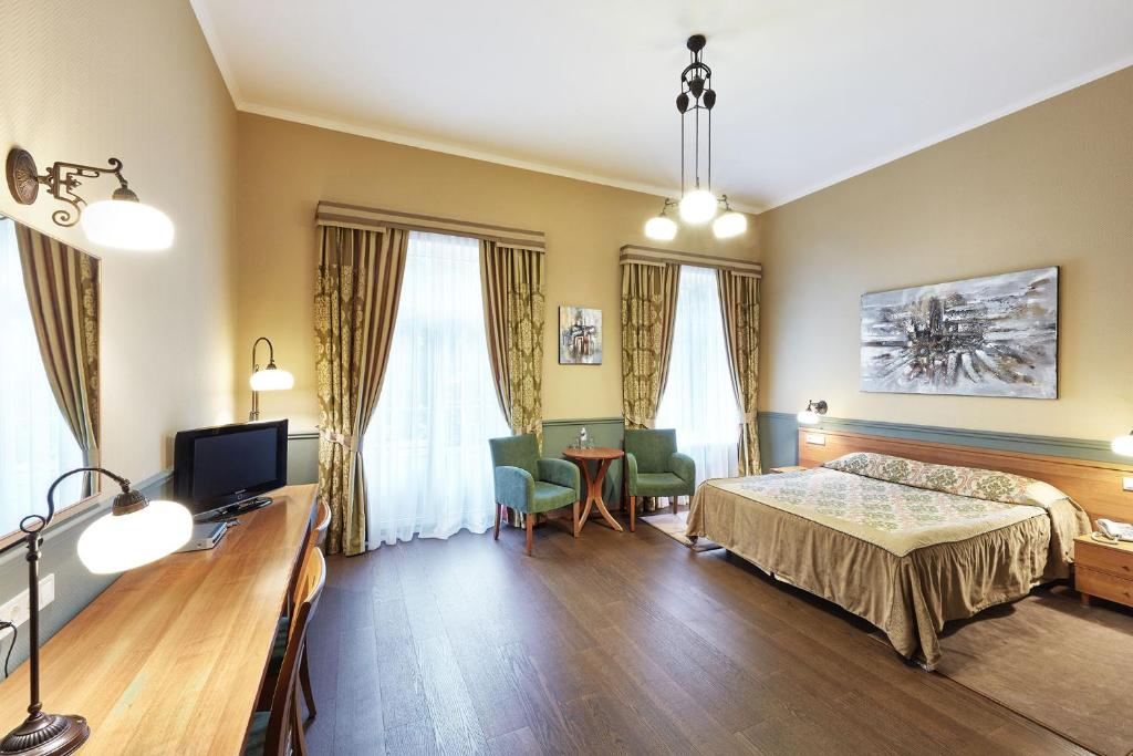 Postel nebo postele na pokoji v ubytování Frapolli Hotel on Deribasivska street