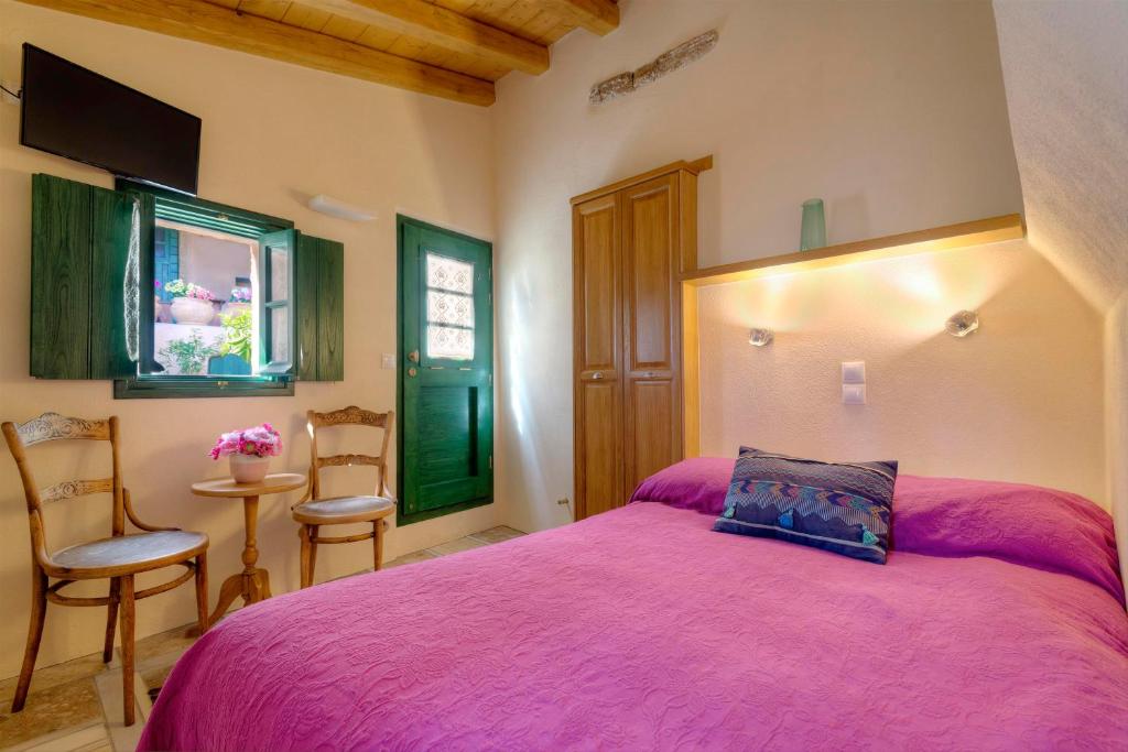 Postel nebo postele na pokoji v ubytování Ritsos Guesthouse